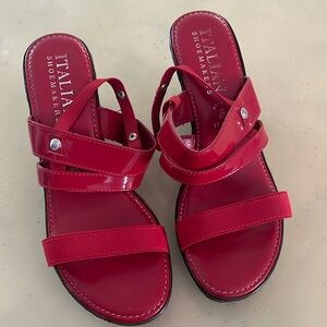 Women’s red strappy wedges.